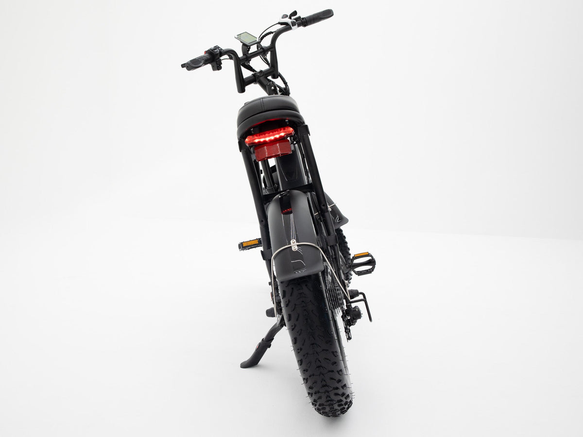 Rear view of Molenstraat Fatbikes DAPPER electric fatbike in black with LED tail light and wide knobby tires
