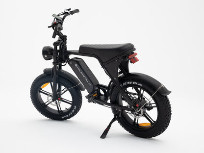 Molenstraat Fatbikes DAPPER electric fatbike in matte black with fat tires, front suspension, and LED headlight.