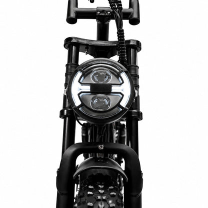 Molenstraat Fatbikes STORM electric fatbike front view featuring a bright circular LED headlight and suspension forks