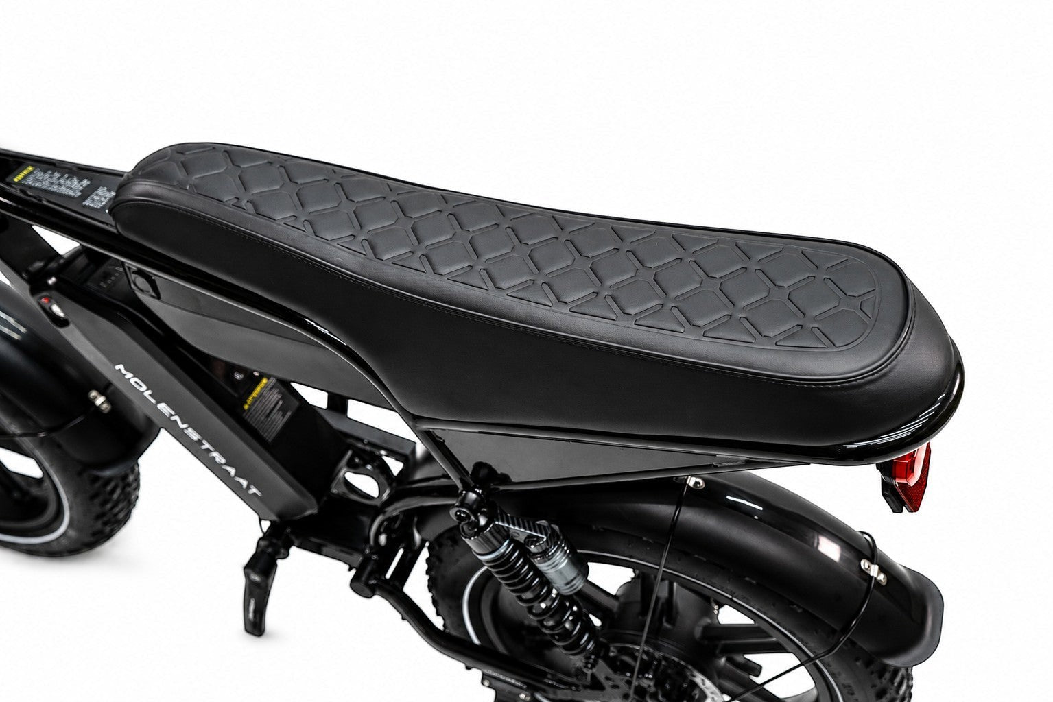 Molenstraat Fatbikes STORM electric bike featuring a black quilted leather bench seat and rear suspension